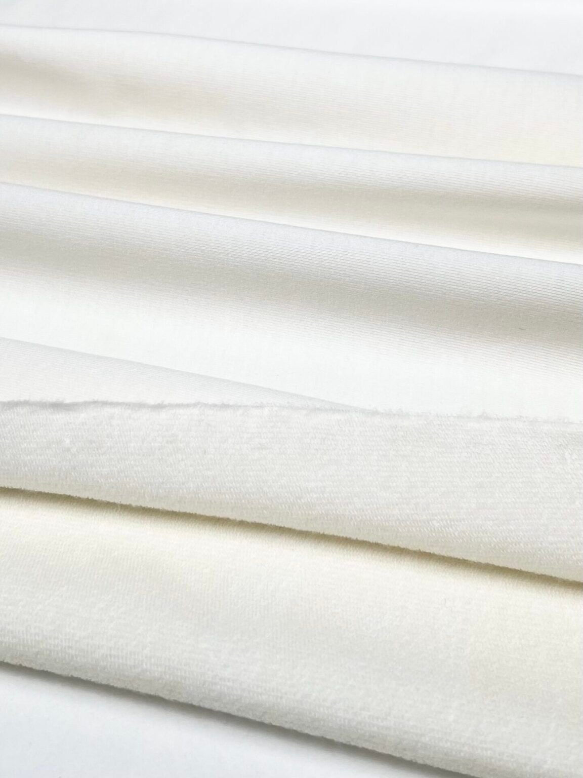 Merino vilnos ir liocelio elastingas dvisiūlis kilpinis trikotažas (premium kokybė) pieno baltos spalvos 004
