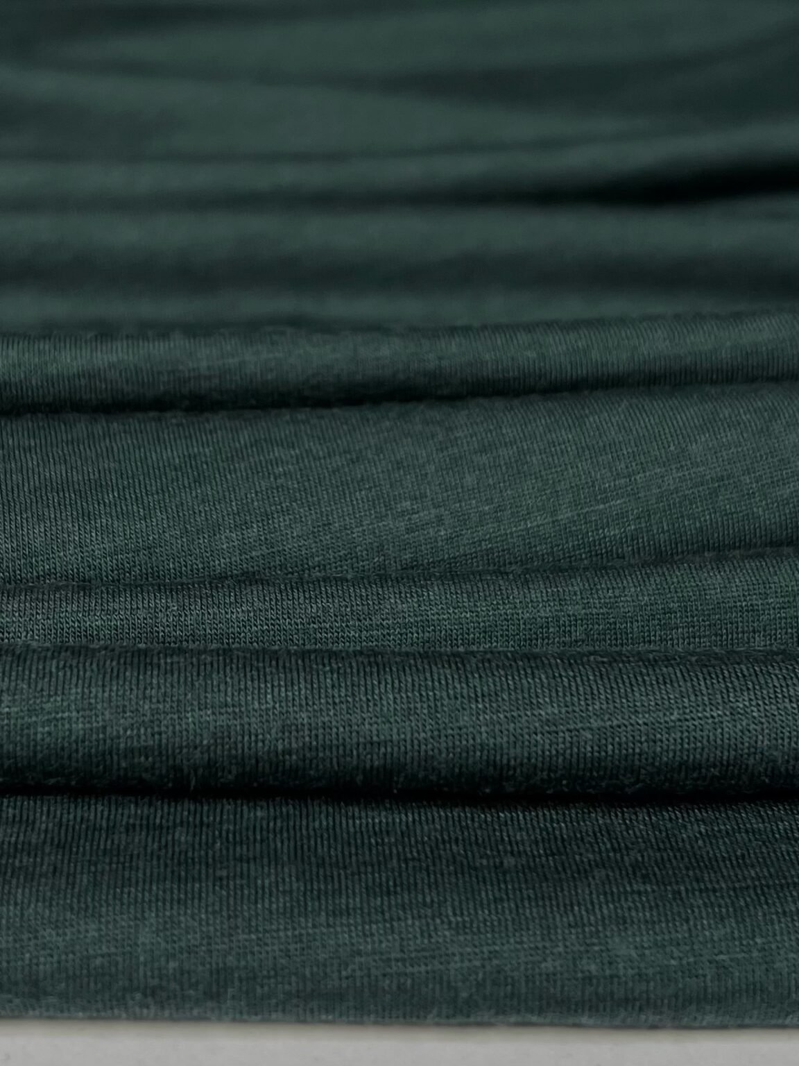 Merino vilnos elastingas trikotažas (premium kokybė) tamsios smaragdinės spalvos 101